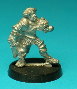Pose 2. This Paladin wears full plate armour with a chainmail skirt, and a long, flowing cloak. He is bare-headed, carrying his ornately decorated helmet in his left hand, while holding a delicate-looking shortsword in his right.