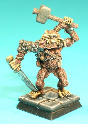 Pose 2, variant B. This variant has a pointed beard, a topknot hairstyle.He has an open, snarling mouth showing his vicious teeth and a protruding tongue. He has long, floppy ears with 2 plain earrings in the left. His head looks to his right and he wields a stone-headed, wooden-hafted hammer in his left hand.