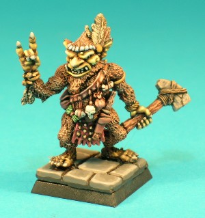 Pose 1. The Shaman - This figure represents a Bugbear Shaman, a tribal spellcaster. He is a large, male Bugbear, wearing a studded leather loincloth and a baldrick with an array of bags, pouches, charms and spell components hanging from it. He holds a large, primitive-looking stone hammer in his left hand, and his right makes an arcane sign as if casting a spell.