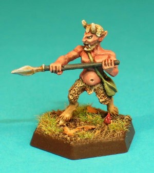 Pose 2, variant A. The satyr figure stands at the ready, holding his spear across his body in both hands, with the point to the right. This variant has a trimmed beard and moustache, and short, sharp horns. He looks to his right with an angry look on his face and his mouth slightly open. He carries a leather shoulder bag.