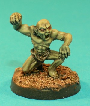 Pose 2, variant A. This is the first of 2 versions of the Ghast, which was replaced by a remodelled version in 1986. This figure wears a tattered loincloth and crouches with his right knee touching the ground, his right arm raised and his left hand resting on his left knee. This variant has a balding head, but with some staggly hair at the back. He looks downwards and to his left with his mouth open in a shout.